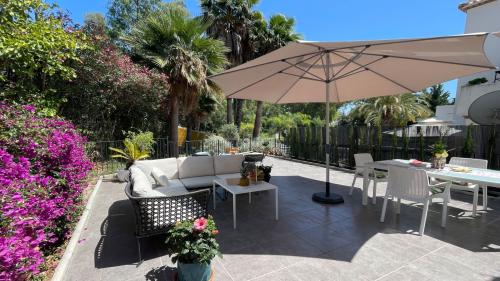 Terrace lounge and dining area with parasol