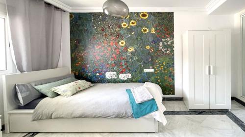 Second bedroom with floral feature wall