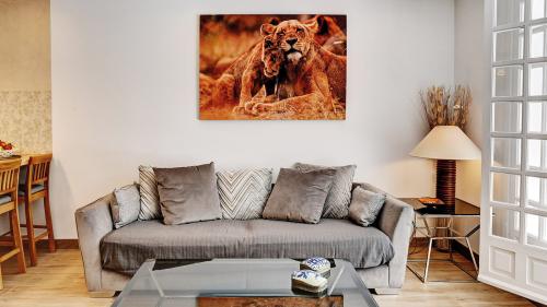 Living room sofa with lion-print artwork
