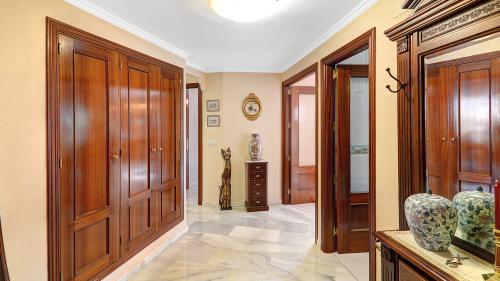 Hallway with fitted wardrobes