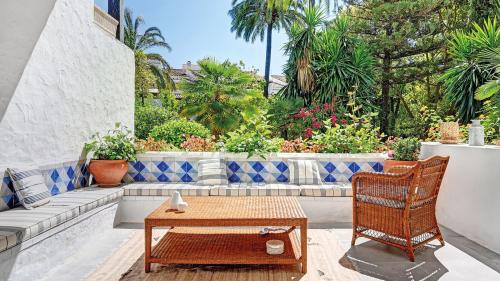 Terrace lounge with tiled bench, overlooking the garden