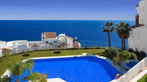 Pool and garden with sea view