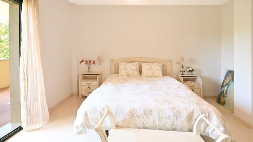 Master bedroom with double bed and floral bedding