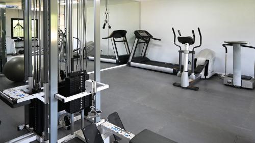 Fully equipped gym with cardio machines and free weights